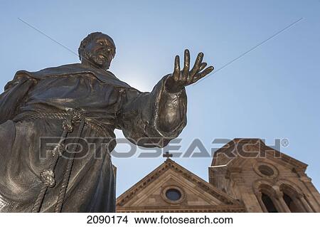 Picture - A Statue Of St. Francis Of Assisi Prominently Adorns The Front Entrance Of The St. Francis Cathedral In Santa Fe, New Mexico, Usa.. Fotosearch
