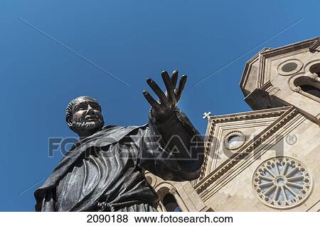 A Statue Of St. Francis Of Assisi Prominently Adorns The Front Entrance Of The St. Francis Cathedral In Santa Fe, New Mexico, Usa View Large Photo Image Stock Photo - A Statue Of St. Francis Of Assisi Prominently Adorns The Front Entrance Of The St. Francis Cathedral In Santa Fe, New Mexico, Usa. Fotosearch