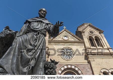 Stock Photography - A Statue Of St. Francis Of Assisi Prominently Adorns The Front Entrance Of The St. Francis Cathedral In Santa Fe, New Mexico, Usa. Fotosearch