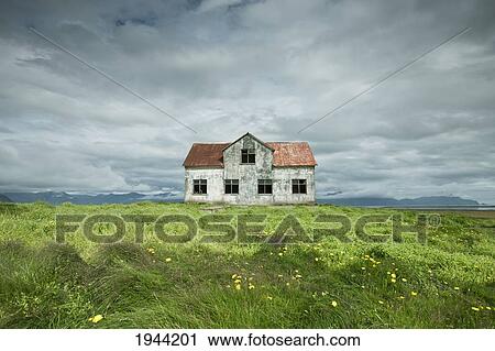 A Stone Building In The Middle Of A Field Under A Cloudy Sky; Iceland View Large Photo Image Stock Image - A Stone Building In The Middle Of A Field Under A Cloudy Sky; Iceland. Fotosearch