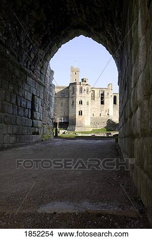 Picture - A Stone Building Through A Tunnel. Fotosearch