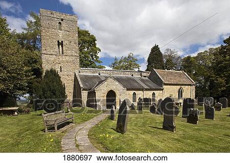 Stock Photo - A Stone Church With A Cemetery; Bolam, Northumberland, England. Fotosearch