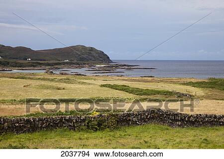 A Stone Fence Across A Field By The Water; Argyll Scotland View Large Photo Image Picture - A Stone Fence Across A Field By The Water; Argyll Scotland. Fotosearch