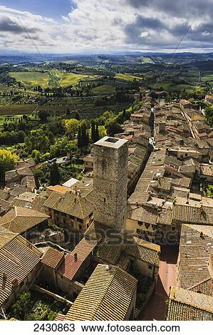 A stone tower and rooftops; San Gimignano, Tuscany, Italy View Large Photo Image Stock Image - A stone tower and rooftops; San Gimignano, Tuscany, Italy. Fotosearch