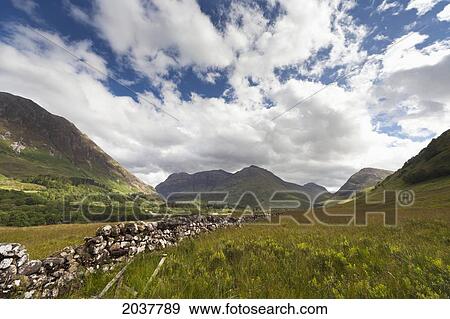 A Stone Wall Through The Fields With Mountains In The Distance; Glencoe Argyll Scotland View Large Photo Image Stock Photo - A Stone Wall Through The Fields With Mountains In The Distance; Glencoe Argyll Scotland. Fotosearch