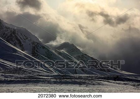 Stock Image - A Storm Clears Over The Cloudy Range Along Dempster Highway, Yukon, Canada. Fotosearch
