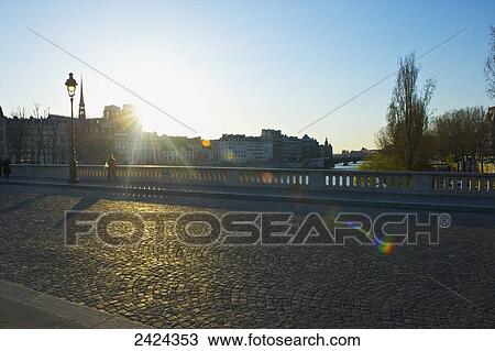 A street over a canal at sunrise; Paris, France View Large Photo Image Stock Image - A street over a canal at sunrise; Paris, France. Fotosearch