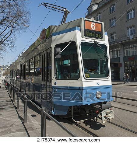 A Streetcar Riding On The Tracks; Zurich Switzerland View Large Photo Image Picture - A Streetcar Riding On The Tracks; Zurich Switzerland. Fotosearch