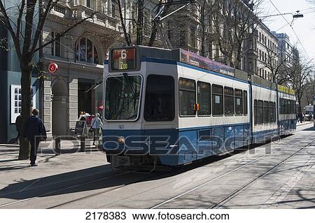 Stock Image - A Streetcar Riding On The Tracks; Zurich Switzerland. Fotosearch