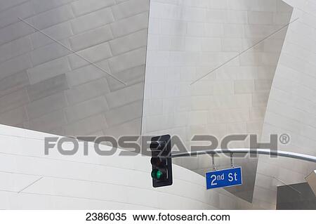 A streetlight and road sign beside a modern building; California, United States of America View Large Photo Image Stock Photography - A streetlight and road sign beside a modern building; California, United States of America. Fotosearch