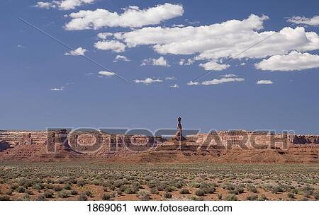 Stock Image - A Tall Rock Formation Along The Cliffs; Utah, Usa. Fotosearch