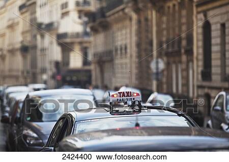 A taxi in traffic; Paris, France View Large Photo Image Stock Image - A taxi in traffic; Paris, France. Fotosearch