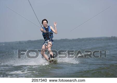 A Teenager Wakeboarding On West Lake In Prince Edward County, Ontario, Canada View Large Photo Image Stock Image - A Teenager Wakeboarding On West Lake In Prince Edward County, Ontario, Canada. Fotosearch