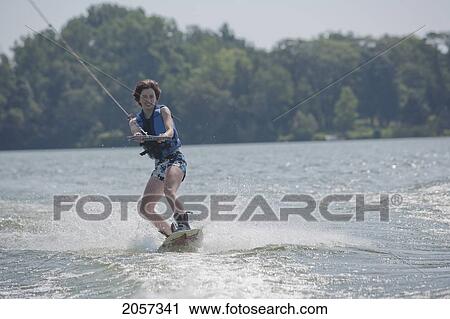 A Teenager Wakeboarding On West Lake In Prince Edward County, Ontario, Canada View Large Photo Image Stock Image - A Teenager Wakeboarding On West Lake In Prince Edward County, Ontario, Canada. Fotosearch