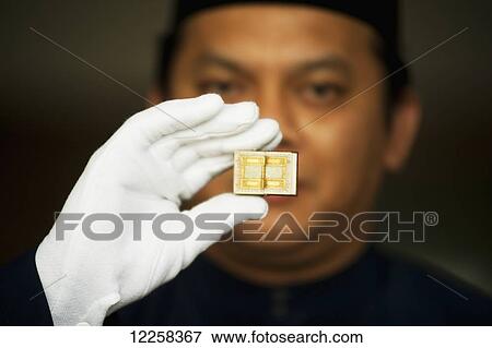 Stock Photo - A tiny Koran at Brunei's Dar al-Salam's Islamic Museum; Bandar Seri Begawan, Brunei. Fotosearch
