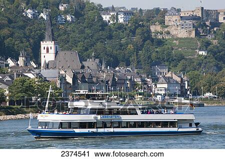 A tour boat sails down the Rhine river; Germany View Large Photo Image Stock Image - A tour boat sails down the Rhine river; Germany. Fotosearch