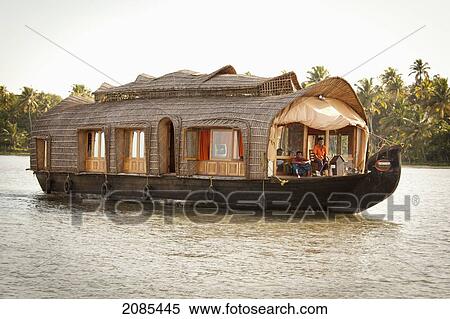 A Tour Boat Traveling Down A River; Kerela India View Large Photo Image Stock Photography - A Tour Boat Traveling Down A River; Kerela India. Fotosearch