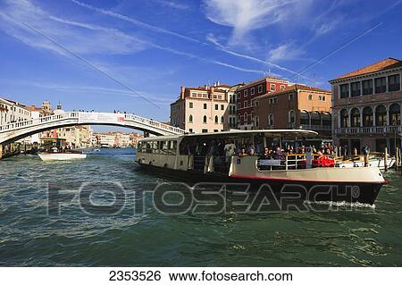Stock Photograph - A Tour Boat Traveling Down The Grand Canal; Venice, Italy. Fotosearch