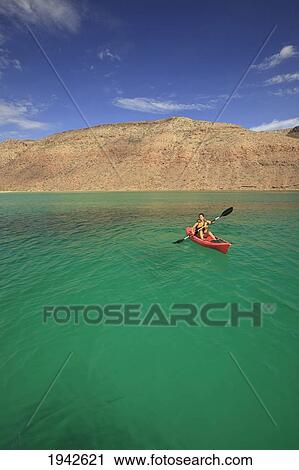 A Tourist Paddles A Boat Off Espiritu Santo Island; La Paz Baja California Mexico View Large Photo Image Stock Image - A Tourist Paddles A Boat Off Espiritu Santo Island; La Paz Baja California Mexico. Fotosearch