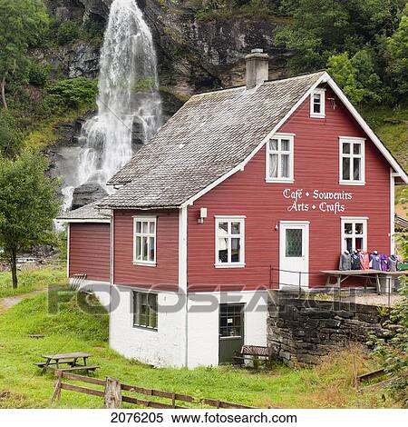 Stock Photography - A Tourist Shop With A Waterfall Behind It; Hardangervidda Norway. Fotosearch