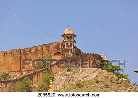 Stock Image - A Tower And Wall At The Corner Of Amer Fort Against A Blue Sky; Jaipur Rajasthan India. Fotosearch