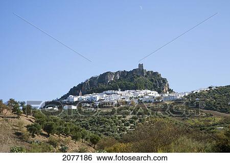 A Town With White Buildings On A Hill And A Blue Sky; Zahara Andalusia Spain View Large Photo Image Stock Photograph - A Town With White Buildings On A Hill And A Blue Sky; Zahara Andalusia Spain. Fotosearch