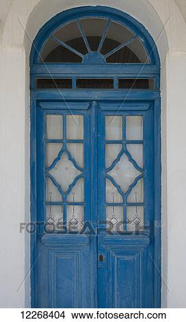 A traditional blue painted wood door with lace curtains; Pano Petali, Sifnos, Cyclades, Greek Islands, Greece View Large Photo Image Picture - A traditional blue painted wood door with lace curtains; Pano Petali, Sifnos, Cyclades, Greek Islands, Greece. Fotosearch