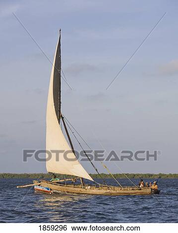Stock Photograph - A Traditional Dhow Boat Sailing Off The Coast Of Lamu, Kenya, East Africa. Fotosearch