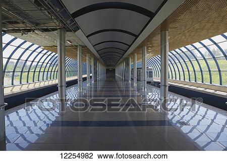 Stock Image - A train enters a modern subway station; Kazan, Republic of Tatarstan, Russia. Fotosearch