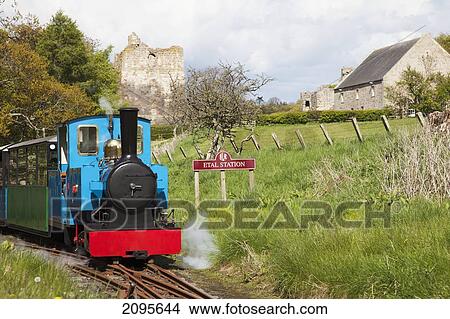A Train Traveling On The Tracks; Etal Northumberland England View Large Photo Image Picture - A Train Traveling On The Tracks; Etal Northumberland England. Fotosearch