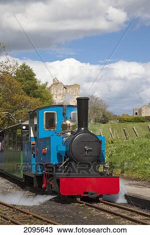 A Train Traveling On The Tracks; Etal Northumberland England View Large Photo Image Stock Image - A Train Traveling On The Tracks; Etal Northumberland England. Fotosearch