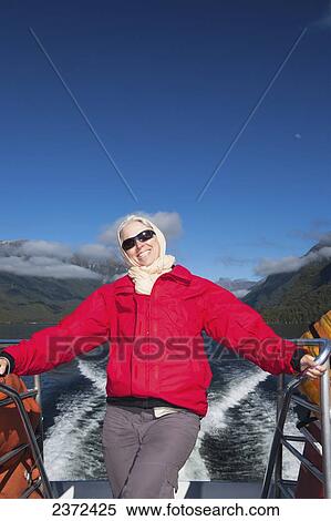 A Traveler Enjoying A Scenic Boat Cruise On Lake Manapouri To Doubtful Sound; New Zealand View Large Photo Image Stock Photography - A Traveler Enjoying A Scenic Boat Cruise On Lake Manapouri To Doubtful Sound; New Zealand. Fotosearch