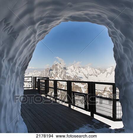 A Tunnel Through A Pile Of Snow On A Walkway; Chamonix-Mont-Blanc Rhone-Alpes France View Large Photo Image Picture - A Tunnel Through A Pile Of Snow On A Walkway; Chamonix-Mont-Blanc Rhone-Alpes France. Fotosearch
