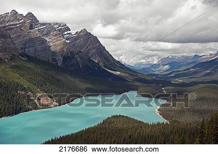 Stock Photograph - A Turquoise Mountain Lake And The Canadian Rocky Mountains; Alberta Canada. Fotosearch