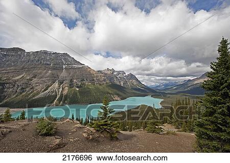 Stock Photograph - A Turquoise Mountain Lake And The Canadian Rocky Mountains; Alberta Canada. Fotosearch