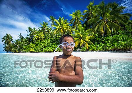 A Tuvalu boy wearing goggles on an island that forms part of a marine park just off the Tuvalu mainland; Tuvalu View Large Photo Image Stock Photo - A Tuvalu boy wearing goggles on an island that forms part of a marine park just off the Tuvalu mainland; Tuvalu. Fotosearch