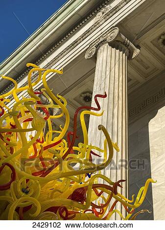 A unique sculpture of red and yellow strands in front of an old building; Montreal, Quebec, Canada View Large Photo Image Stock Image - A unique sculpture of red and yellow strands in front of an old building; Montreal, Quebec, Canada. Fotosearch