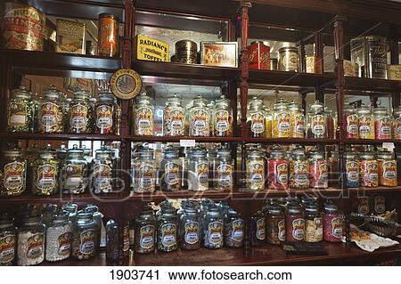 Stock Image - A Variety Of Candies On Display In Glass Jars On Shelves; Beamish, Durham, England. Fotosearch