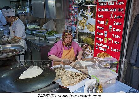 A vendor prepares food in a food stall; Istanbul, Turkey View Large Photo Image Stock Image - A vendor prepares food in a food stall; Istanbul, Turkey. Fotosearch