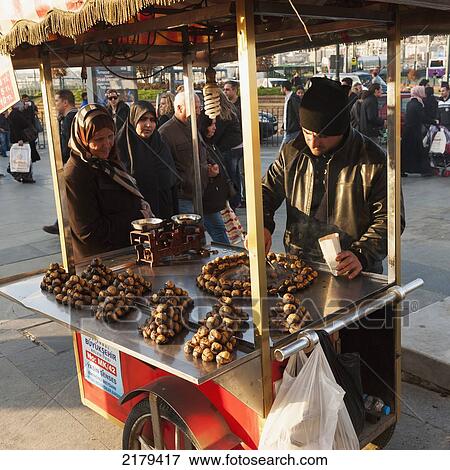 Stock Photo - A Vendor Sells Food From His Cart; Istanbul Turkey. Fotosearch