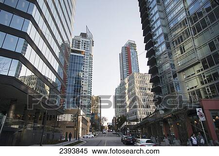 A view down a downtown Vancouver street and residential skyscrapers; Vancouver, British Columbia, Canada View Large Photo Image Stock Photography - A view down a downtown Vancouver street and residential skyscrapers; Vancouver, British Columbia, Canada. Fotosearch