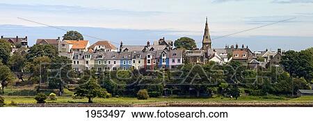 A View Of Colorful Buildings In A Village; Alnmouth Northumberland England View Large Photo Image Stock Photo - A View Of Colorful Buildings In A Village; Alnmouth Northumberland England. Fotosearch