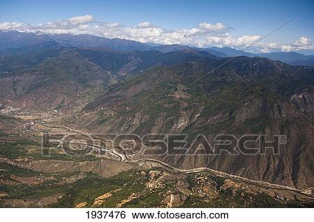 Stock Photograph - A View Of Paro Valley; Paro Valley Taktsang Bhutan. Fotosearch