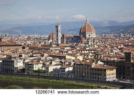 Stock Image - A view of the city from above with the dome of the Florence Cathedral; Florence, Italy. Fotosearch