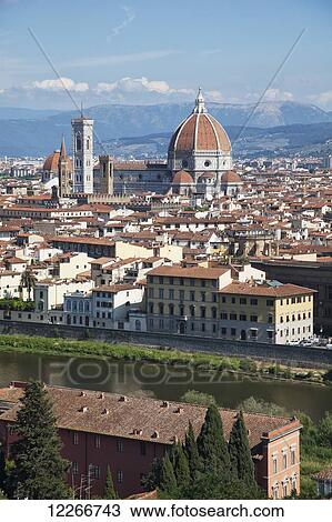 Stock Image - A view of the city from above with the dome of the Florence Cathedral; Florence, Italy. Fotosearch