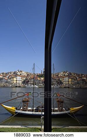 Stock Image - A View Of The City Of Oporto Partly Reflected On A Glass Window. Fotosearch