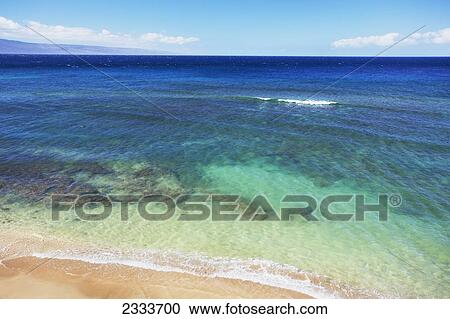 Stock Image - A view of the clear ocean and coral; Kaanapali, Maui, Hawaii, United States of America. Fotosearch