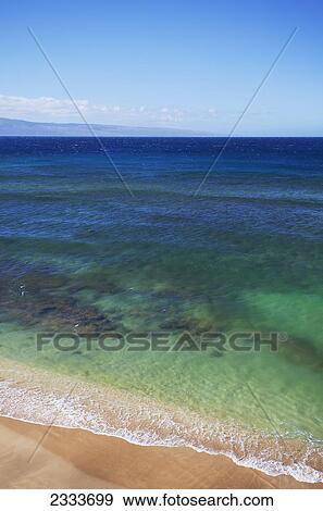 Stock Photo - A view of the clear ocean and coral; Kaanapali, Maui, Hawaii, United States of America. Fotosearch