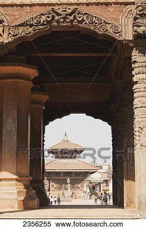 A view through collosal carved arches towards the Gopi Nath Temple in Bhaktapur Durbar Square; Bhaktapur, Nepal View Large Photo Image Stock Photography - A view through collosal carved arches towards the Gopi Nath Temple in Bhaktapur Durbar Square; Bhaktapur, Nepal. Fotosearch
