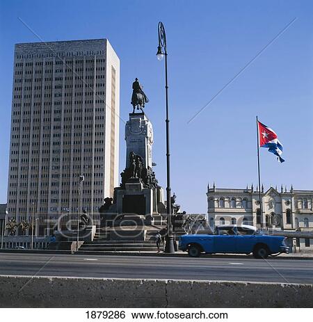 Stock Photograph - A Vintage Car By The Calixto Garcia Statue.. Fotosearch